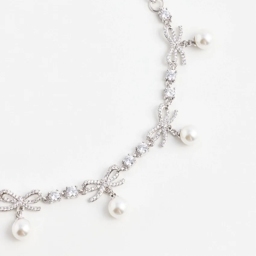 Crystal Bow Pearl Charm Bracelet Crystal Bow Pearl Charm Bracelet