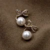 Gold Bow Pearl Jacket Earrings